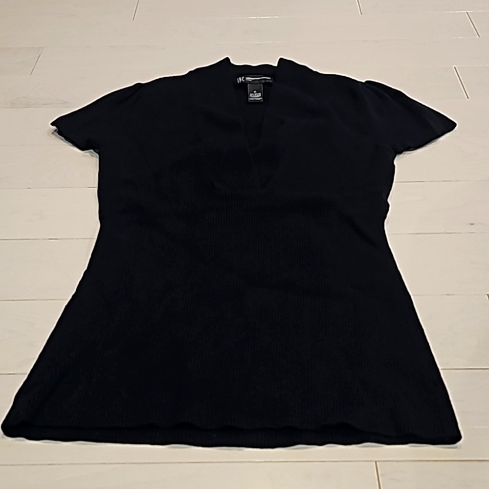 Size medium, V neck, shirt sleeve, INC sweater.